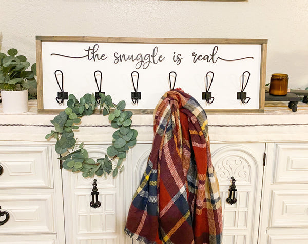 The snuggle is real blanket/coat hook with 3d wood cutout and metal hooks